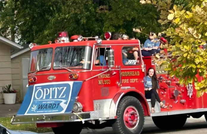 Moorhead City Council candidate Sarah Opitz’s use of fire truck during parade goes to a hearing — Watford City Government news